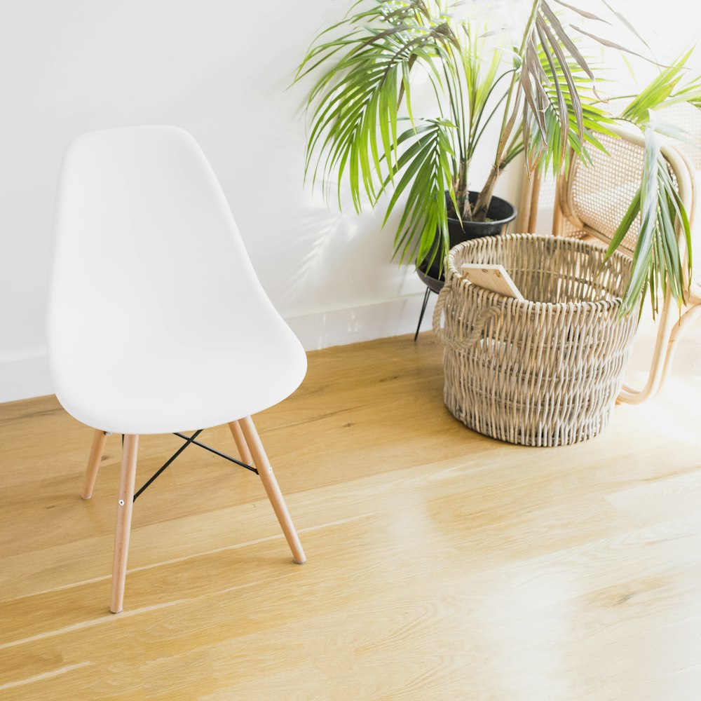 white and brown chair beside brown wicker basket