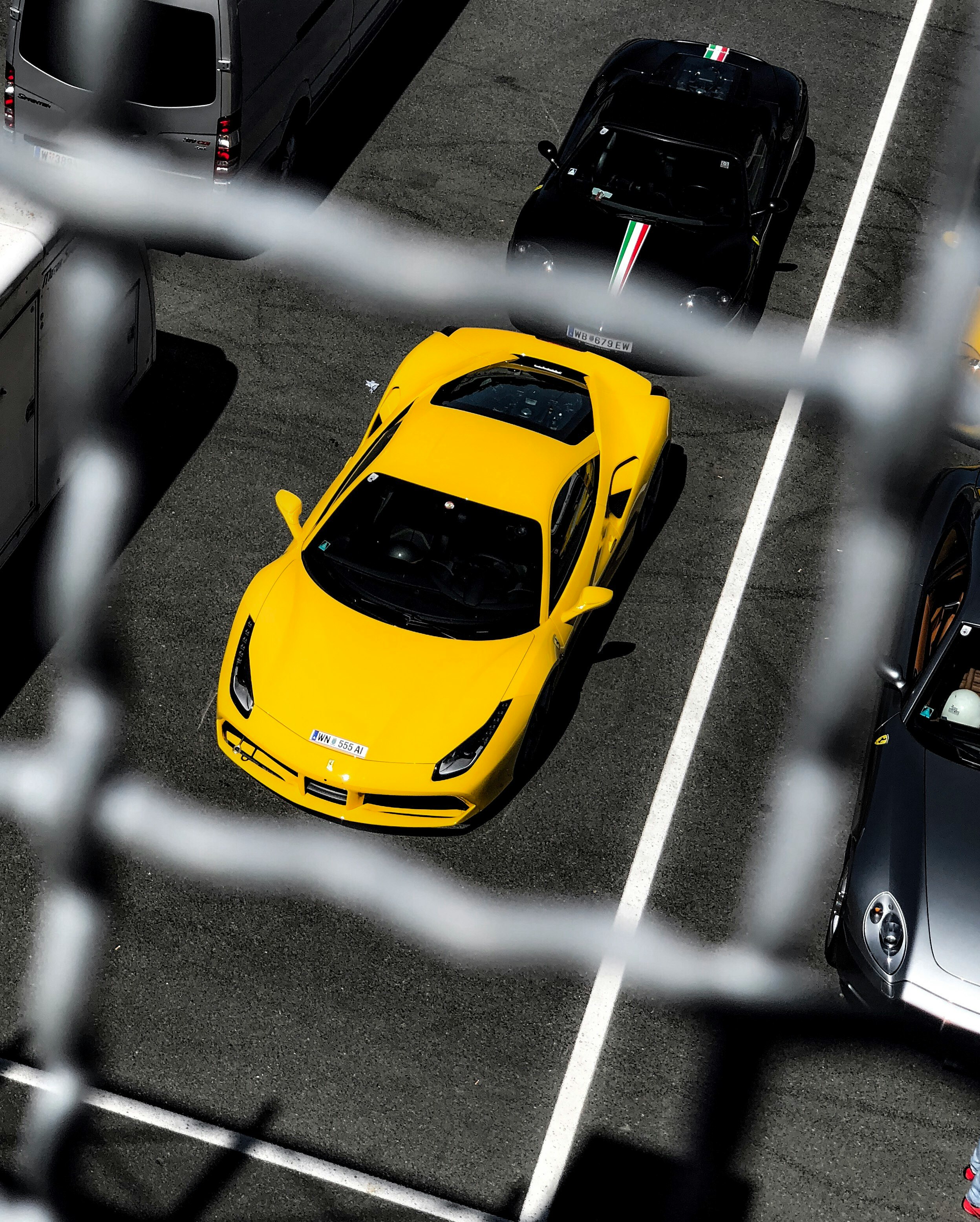 selective focus photography of yellow and black luxury cars