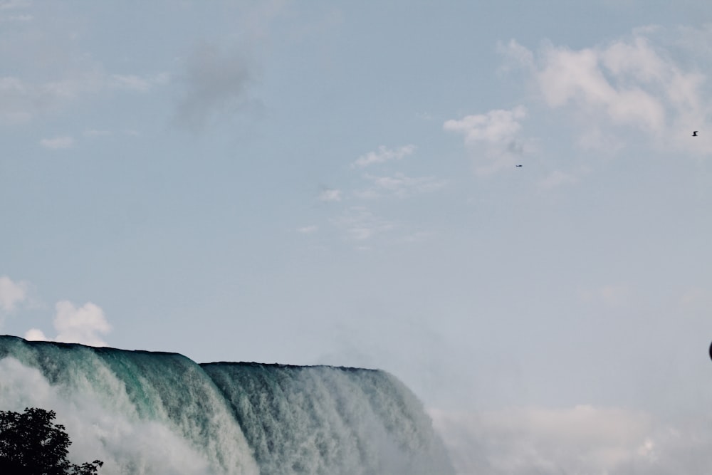 low-angle photography of waterfalls