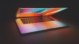 An elegant laptop open with a vibrant screen.