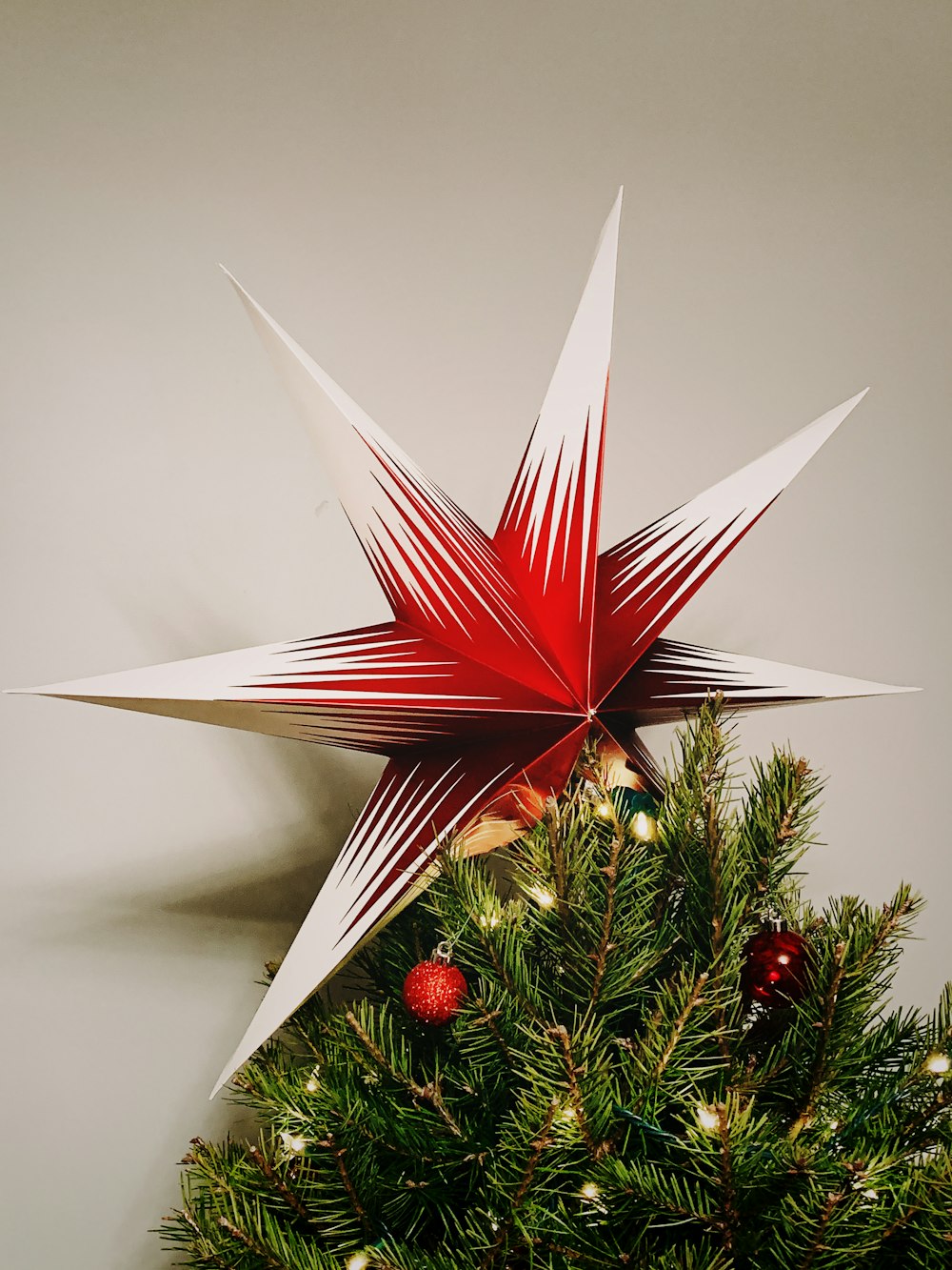 red and white star tree topper