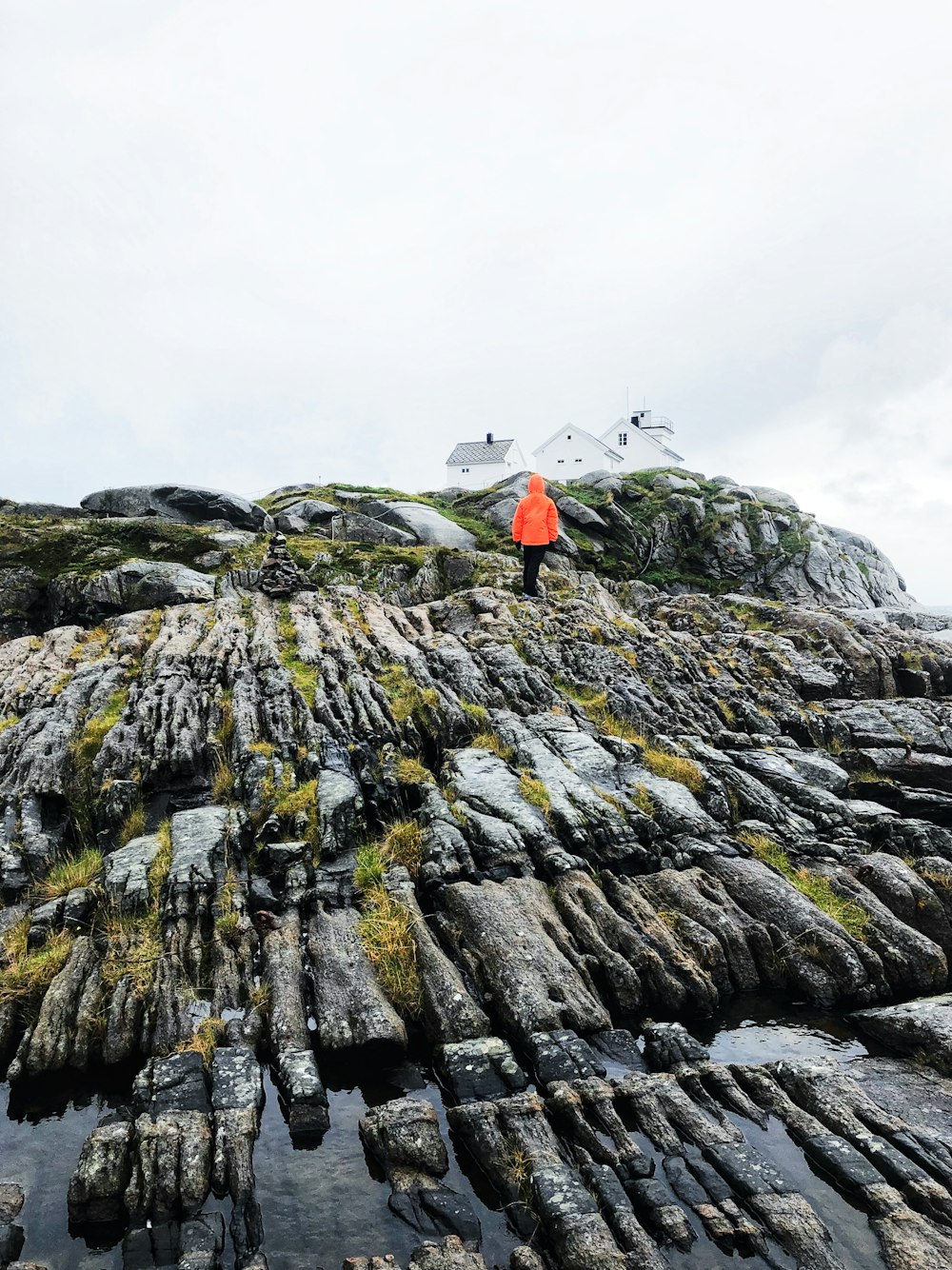 person standing on mountain during day time