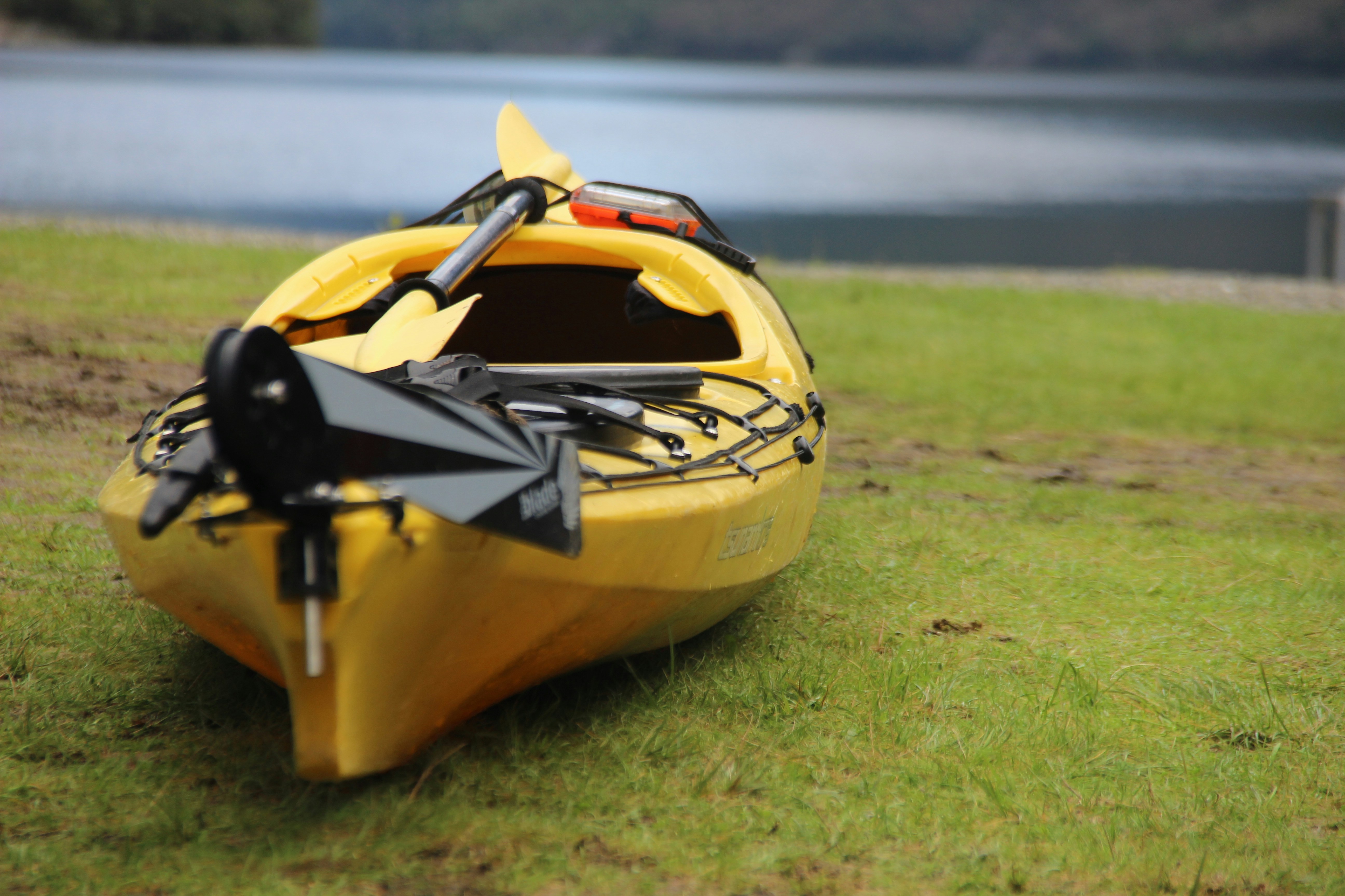 selective focus photography of yellow kayak