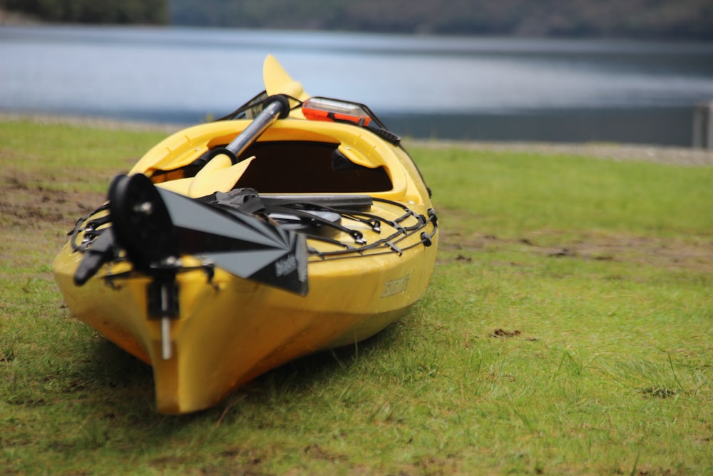 selective focus photography of yellow kayak