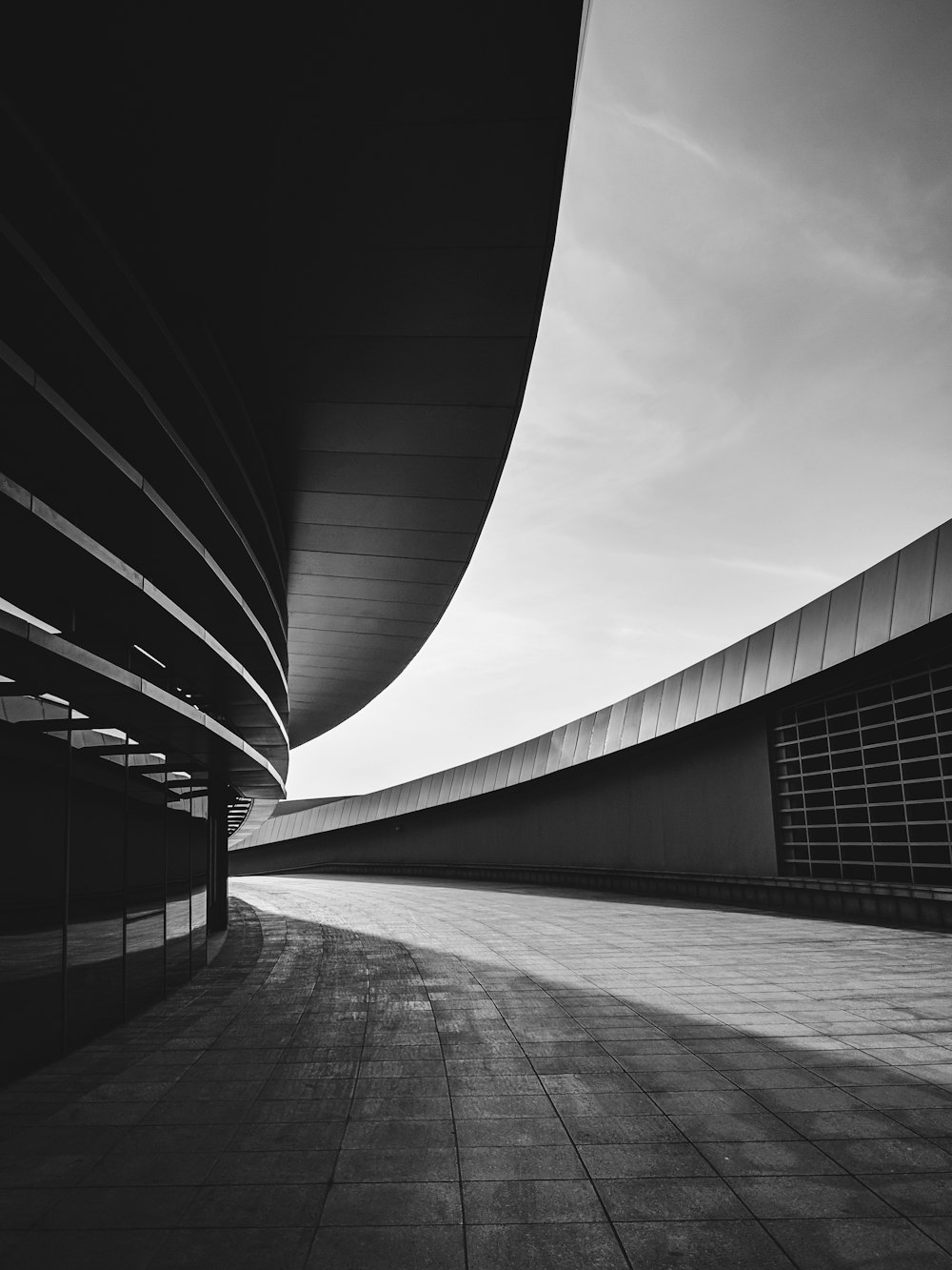 grayscale photography of concrete pathway