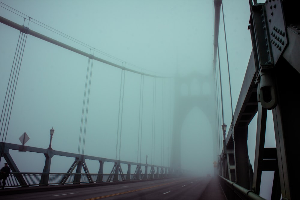 fog covered steel bridge