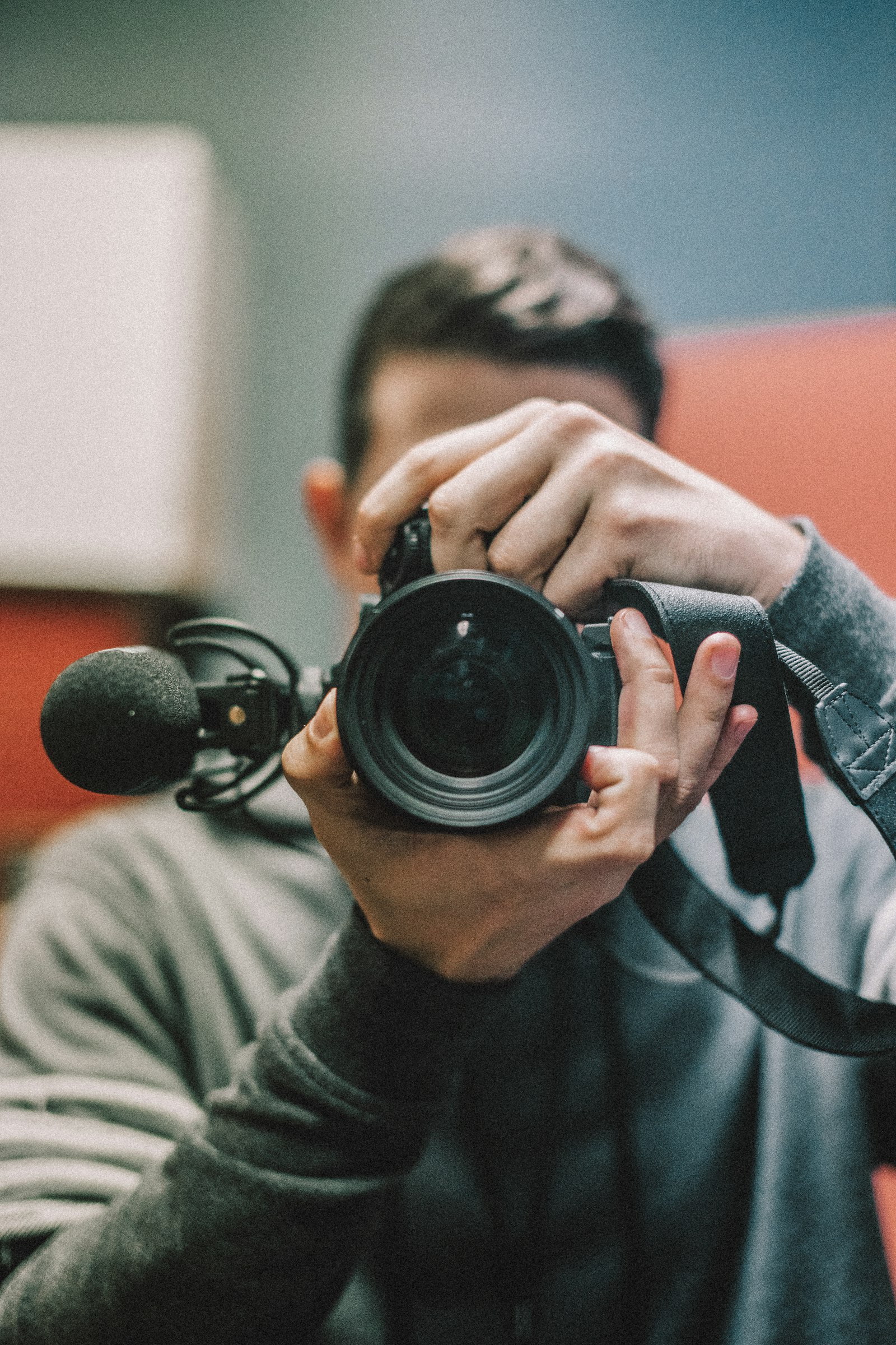 Sigma 50mm F1.4 EX DG HSM sample photo. Man holding dslr camera photography