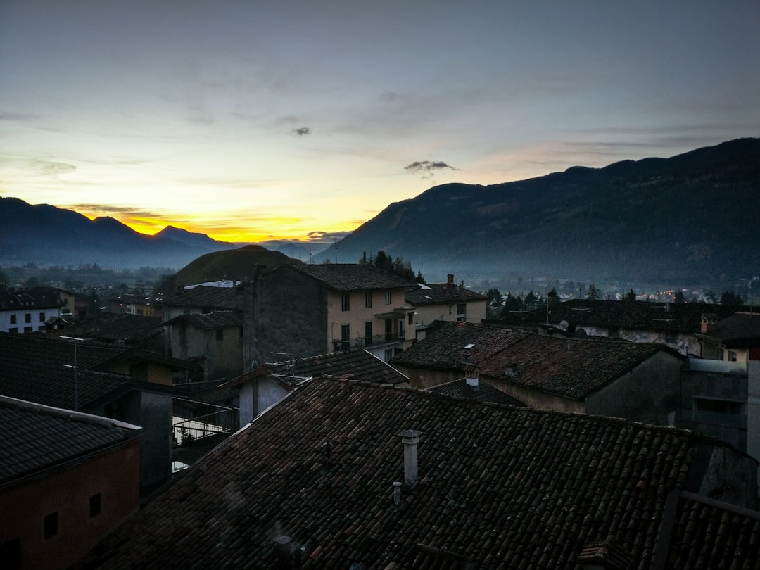 landscape photography of houses near mountains