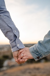 two person holding hands