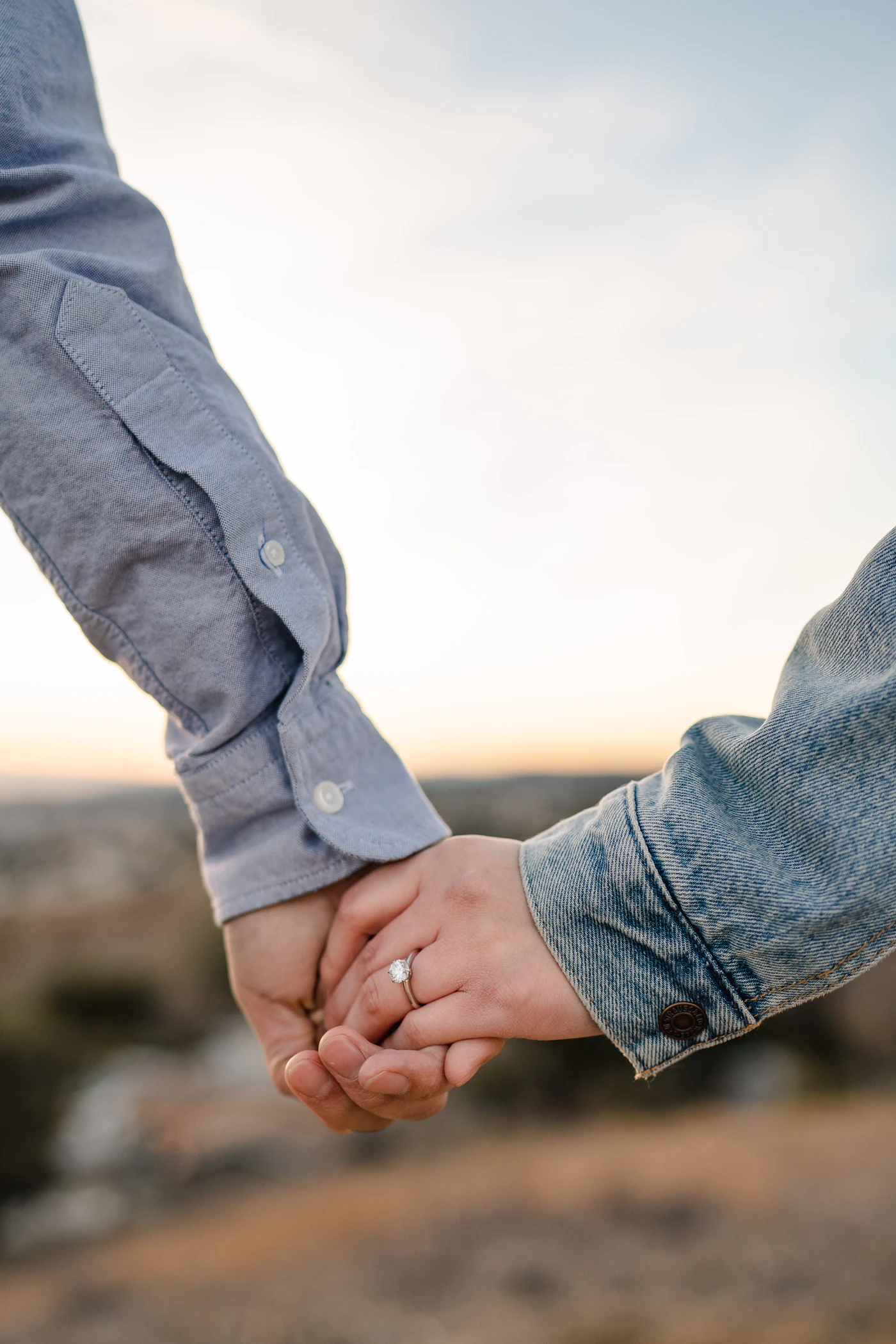 Two people holding hands