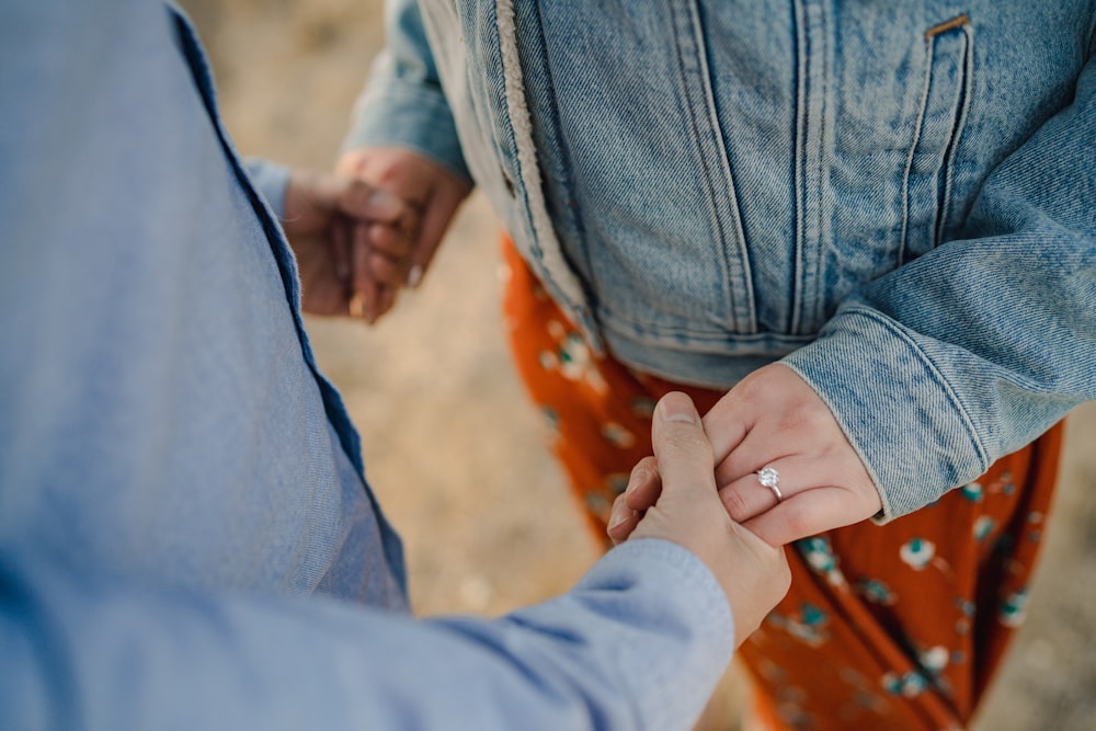 man and woman holding hands