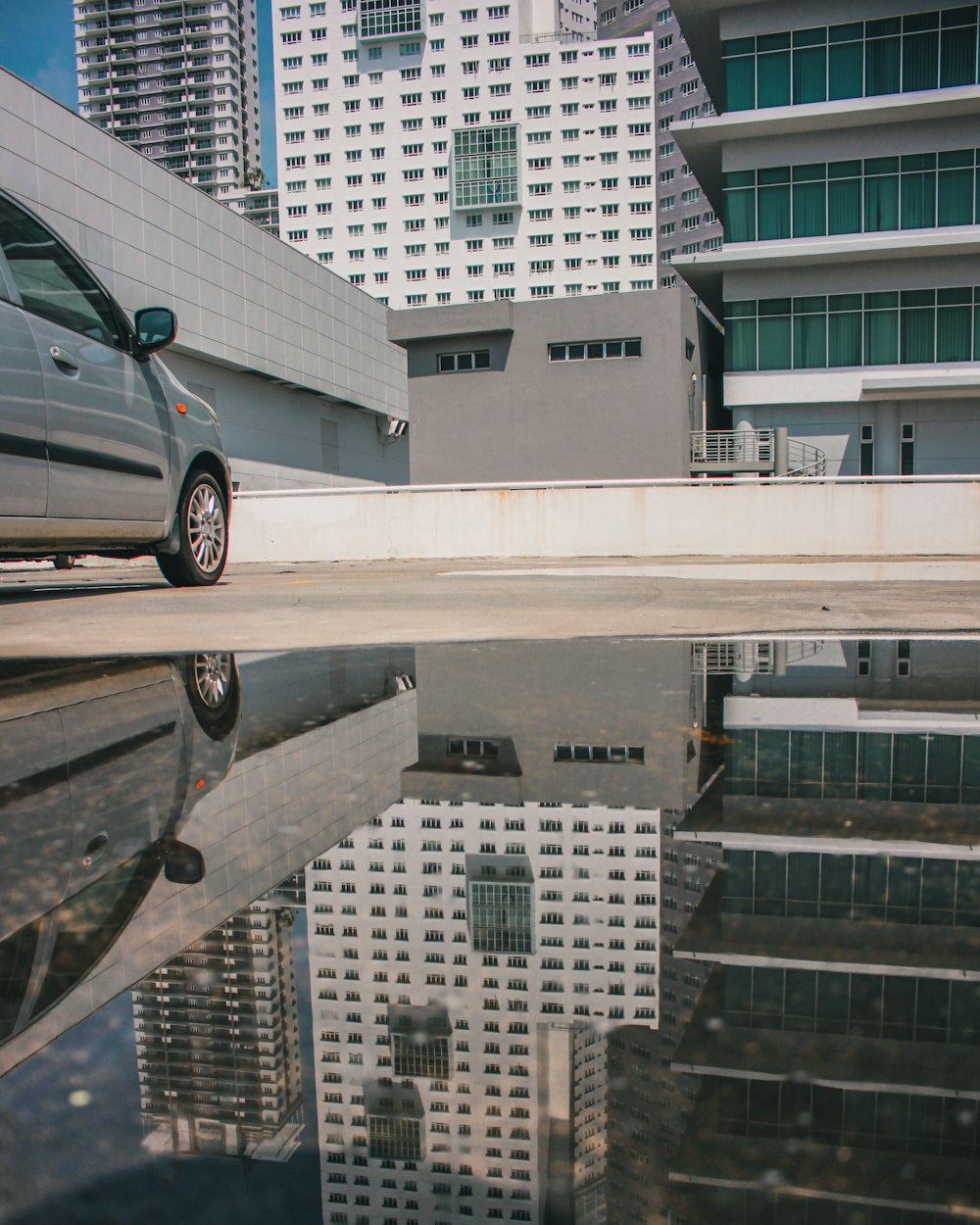 parked gray car near building