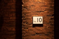 no. 10 sign on brick wall