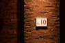 no. 10 sign on brick wall