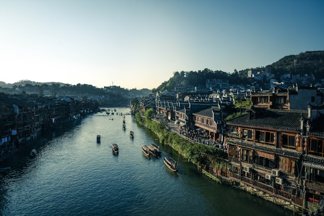 bird's-eye view photography of boats near houses