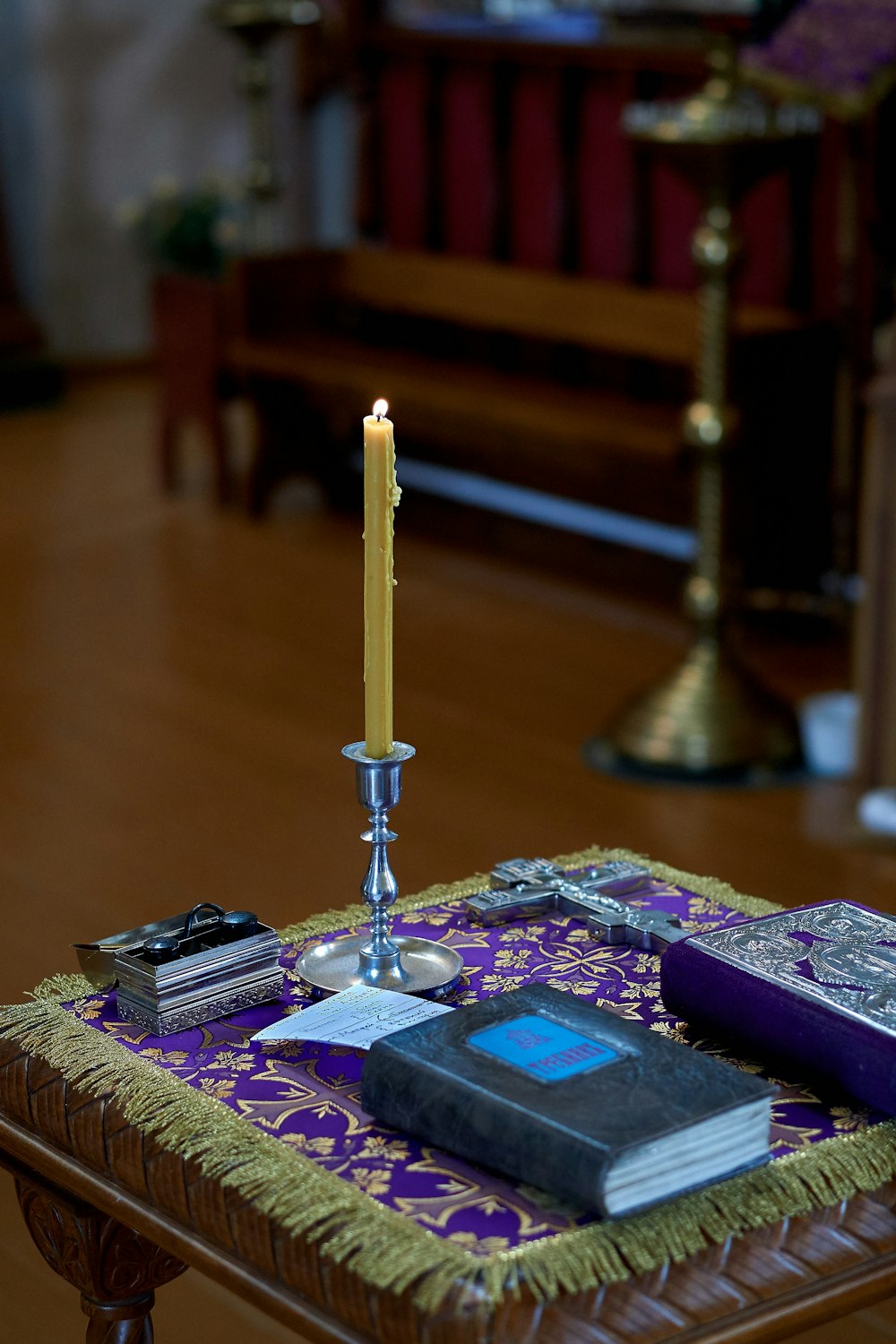 two gray and purple books on table