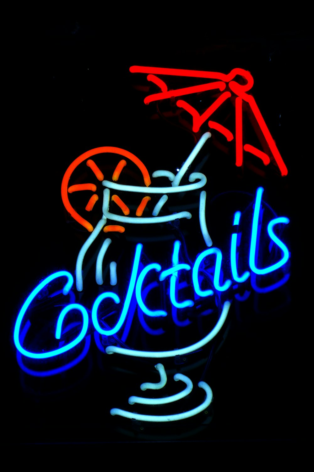 blue and red cocktails neon signage