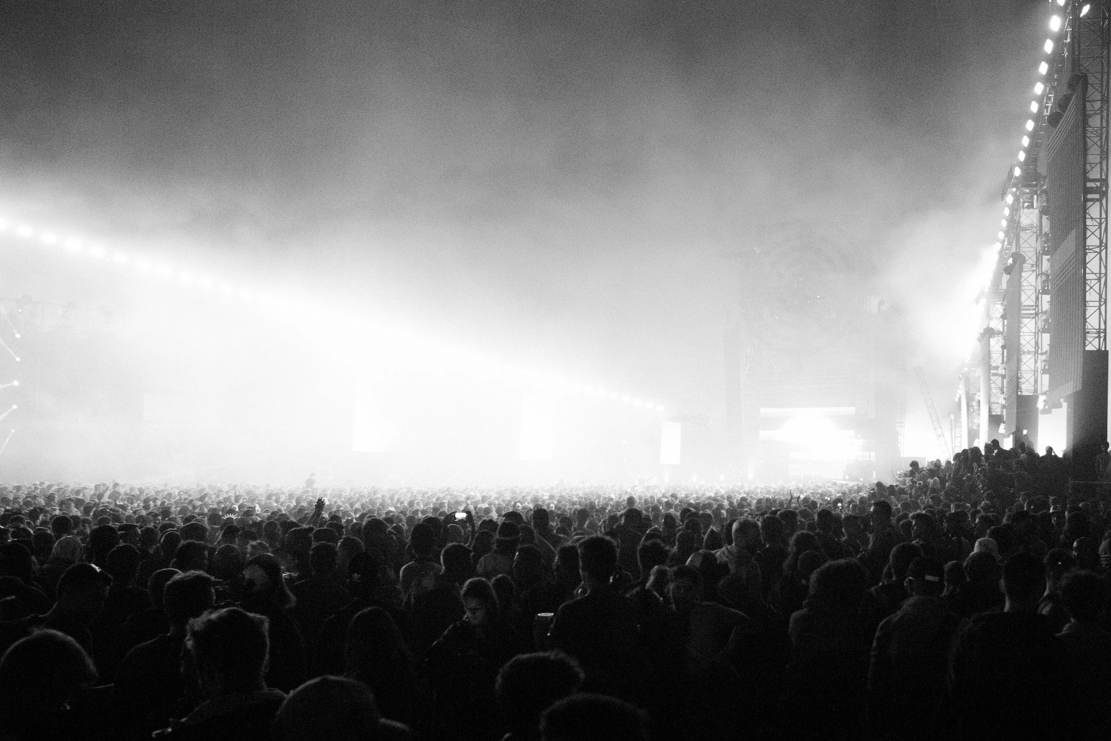 Concert crowd beneath stage lights