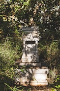 An ancient shrine surrounded by vibrant flora.
