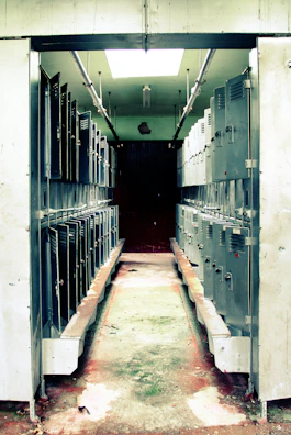 Wide aisle between rows of secure storage lockers in the facility.