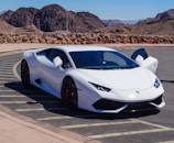 A sleek compact car parked in a scenic location.