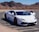 A sleek, modern car parked in a scenic outdoor setting.