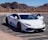 A sleek, modern car parked in a scenic outdoor setting.