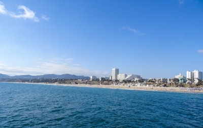 A vibrant collage showing a beach, city skyline, and mountain adventure.