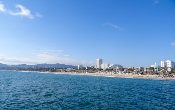 A vibrant collage showing a serene beach, a mountain hike, and a bustling cityscape.