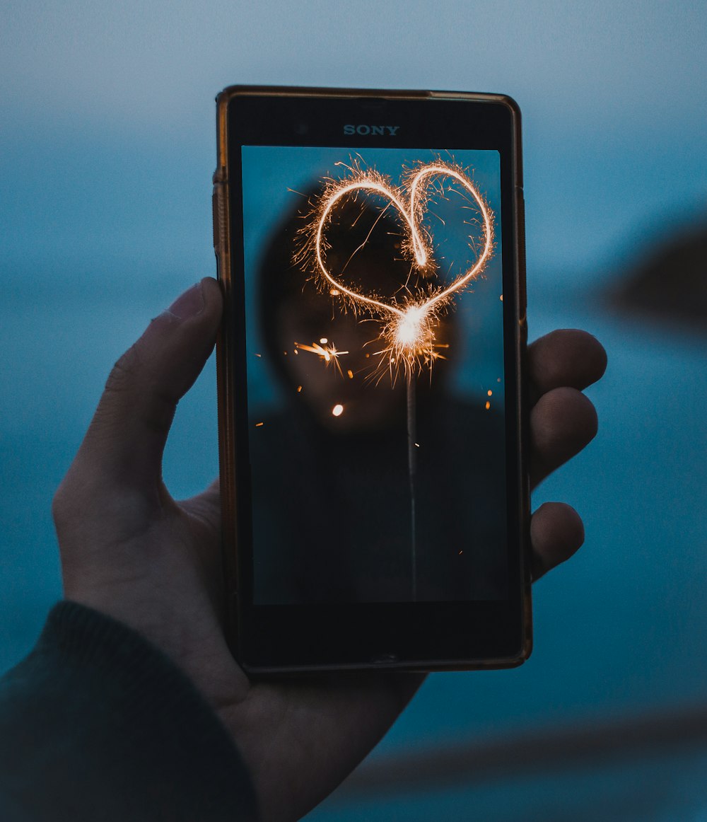 person holding black Sony Android smartphone