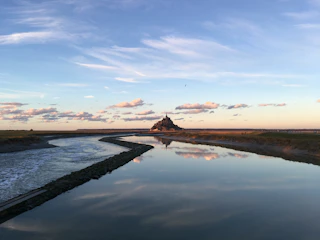 A serene landscape from a relaxing adventure game with soft colors and detailed art.