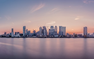 A panoramic view of a modern city skyline at sunset, symbolizing growth and innovation.