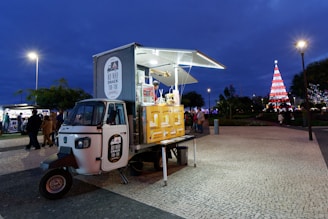 yellow and white auto rickshaw food stall