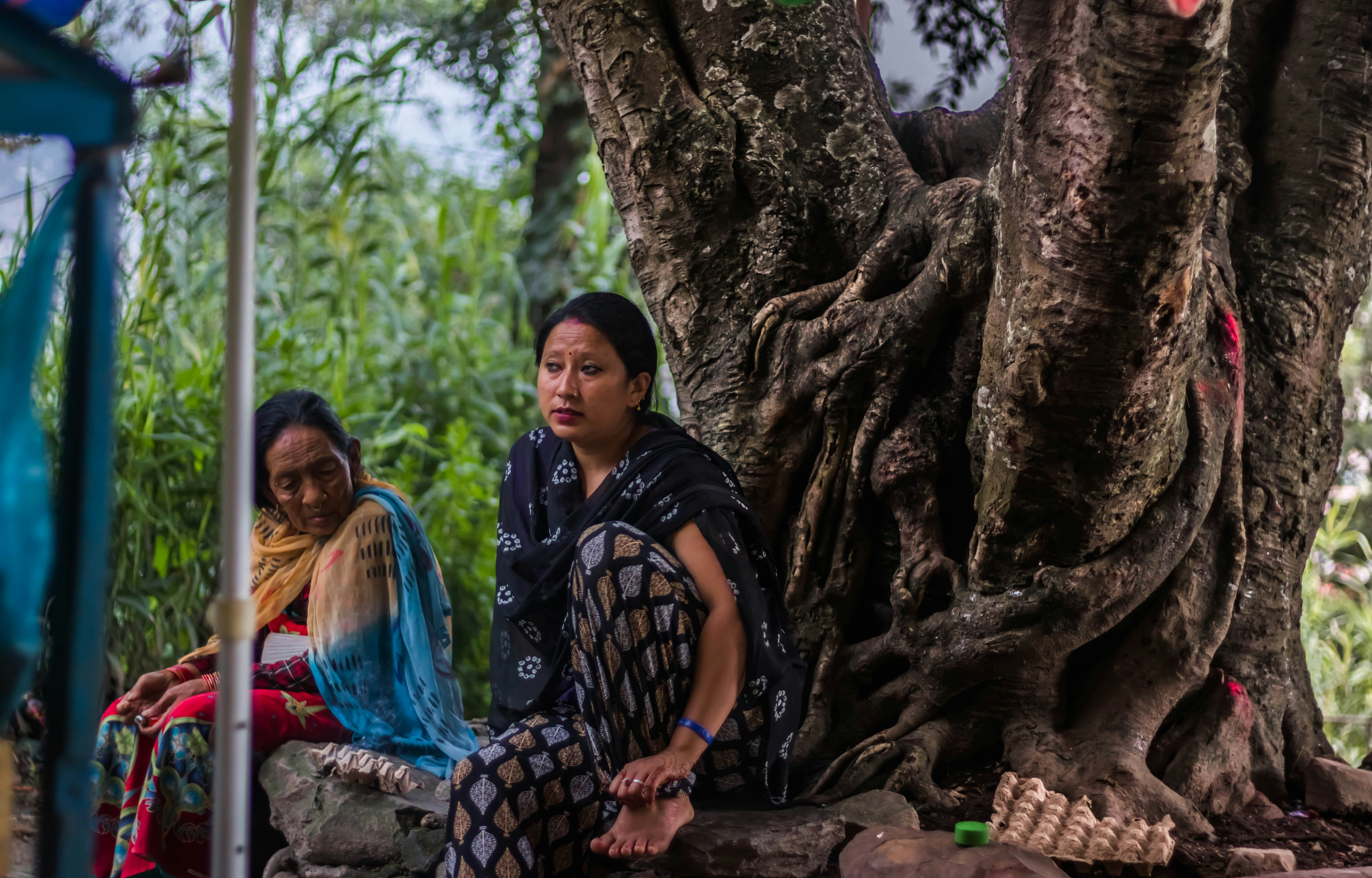 married Hindu women praying under banyan tree ritual