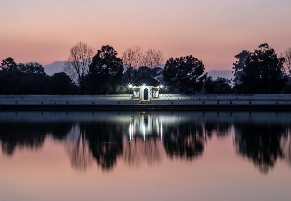 white cabin near body of water