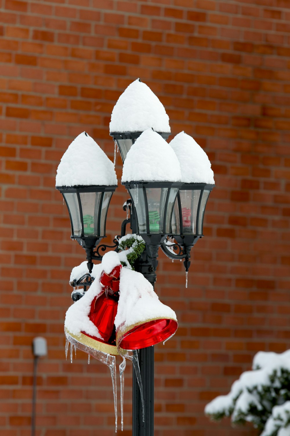 white lamppost covered in snow