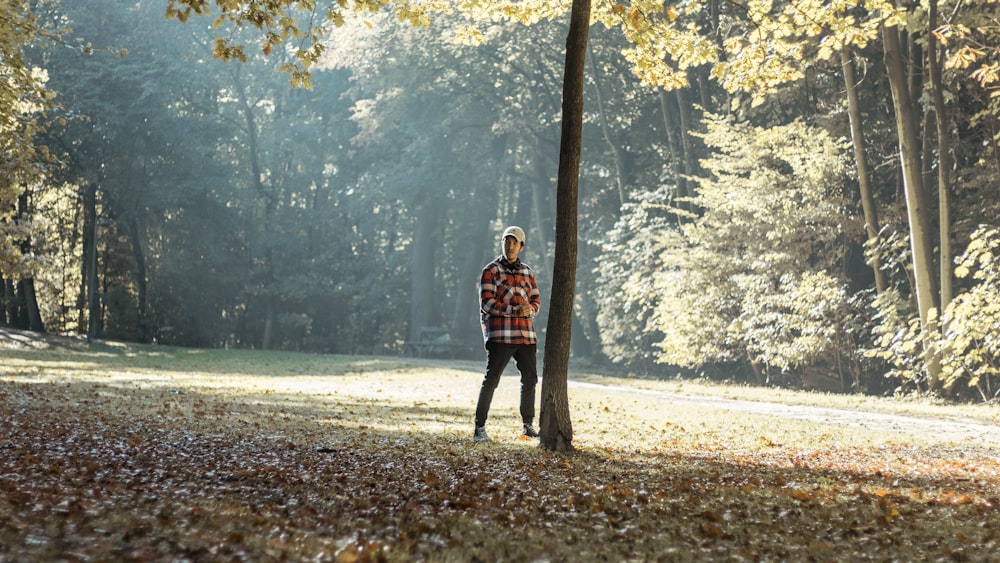 man standing near tree