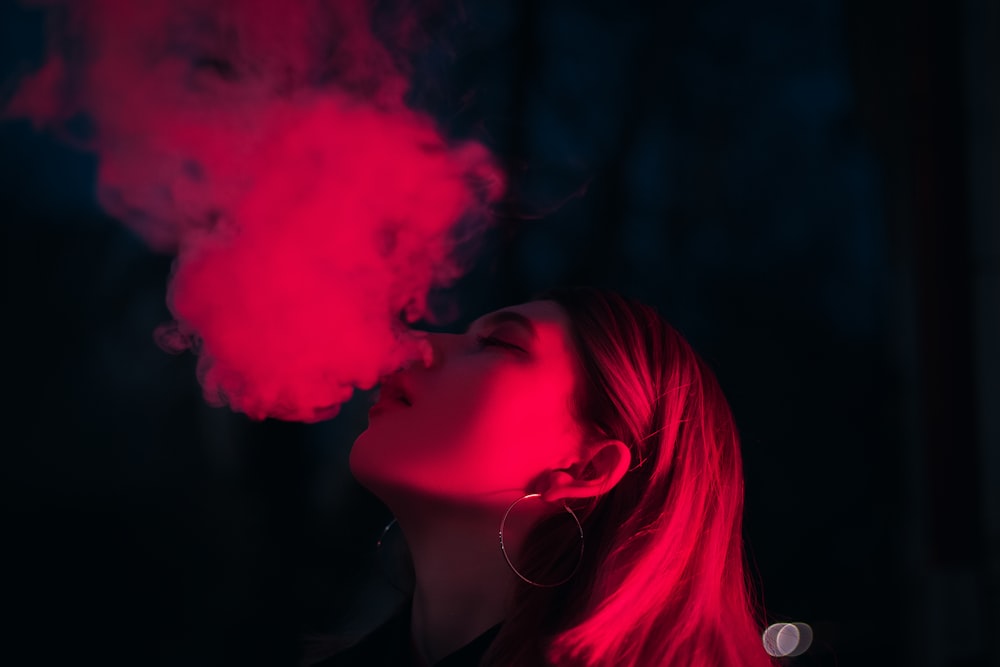 woman blow smoke