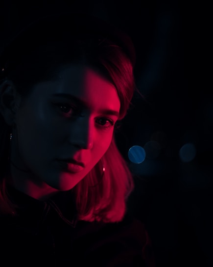 A close-up portrait of a church leader illuminated softly in low light, showcasing the effect of professional photo editing.