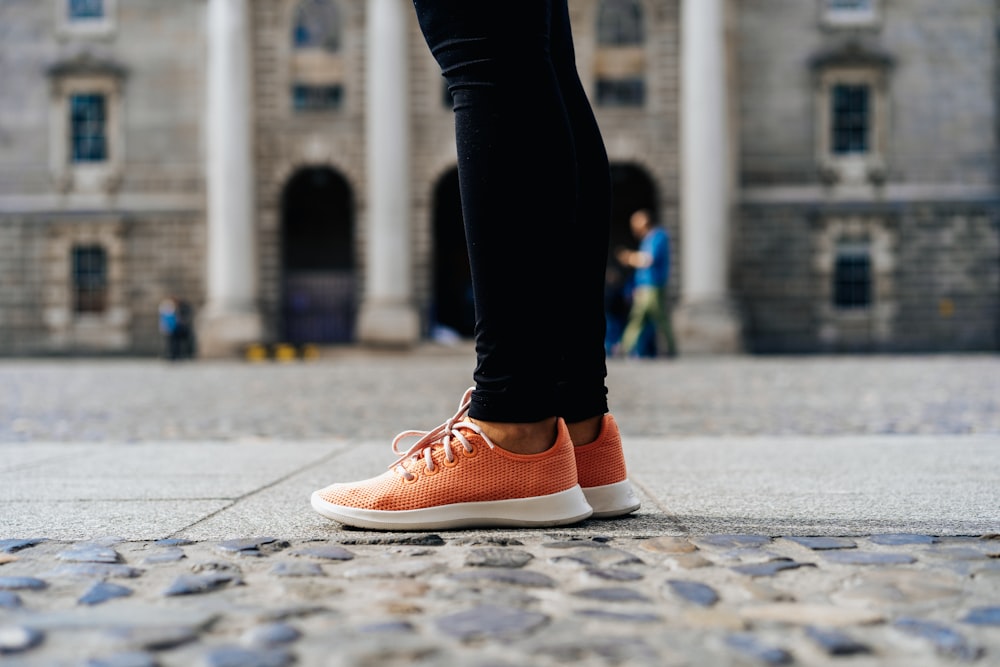 pair of orange low-top shoes
