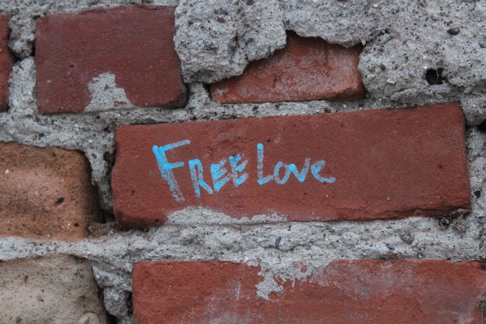 free love-printed brick during daytime