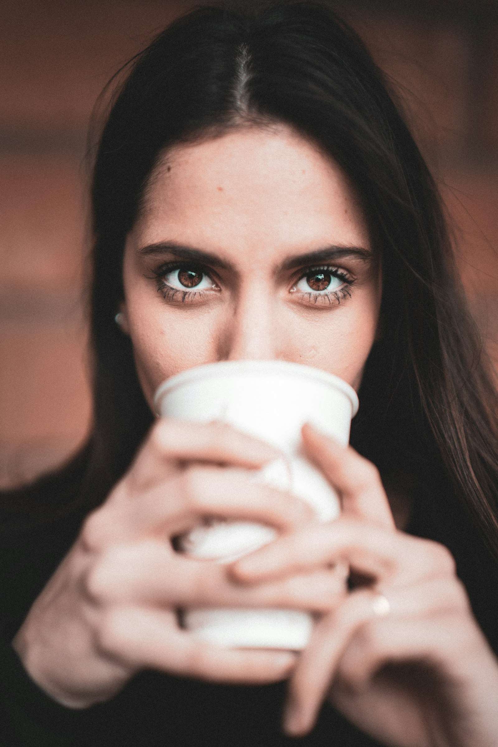 Samyang AF 50mm F1.4 FE sample photo. Woman holding white disposable photography