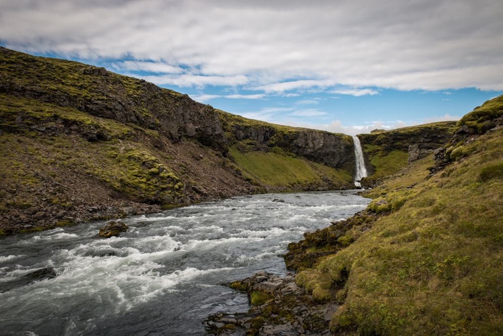 landscape photography of green mountains and \waterfalls