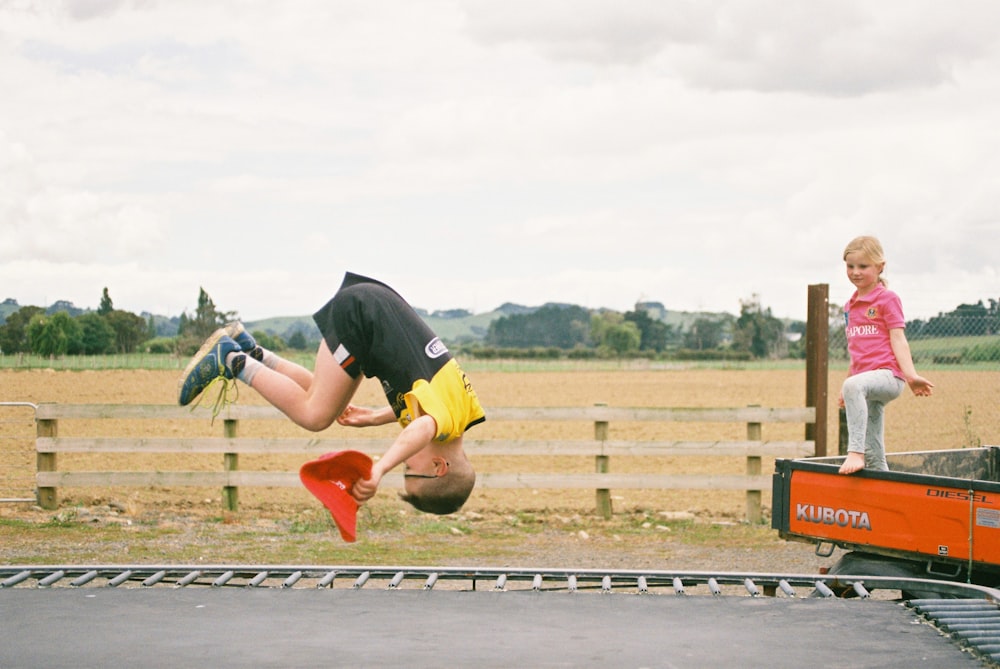 boy performing front flip