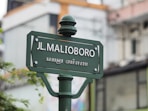 selective focus photo of JL. Malioboro street signage