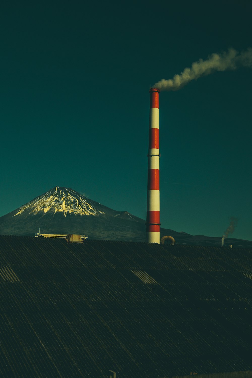 red and white smoke tower