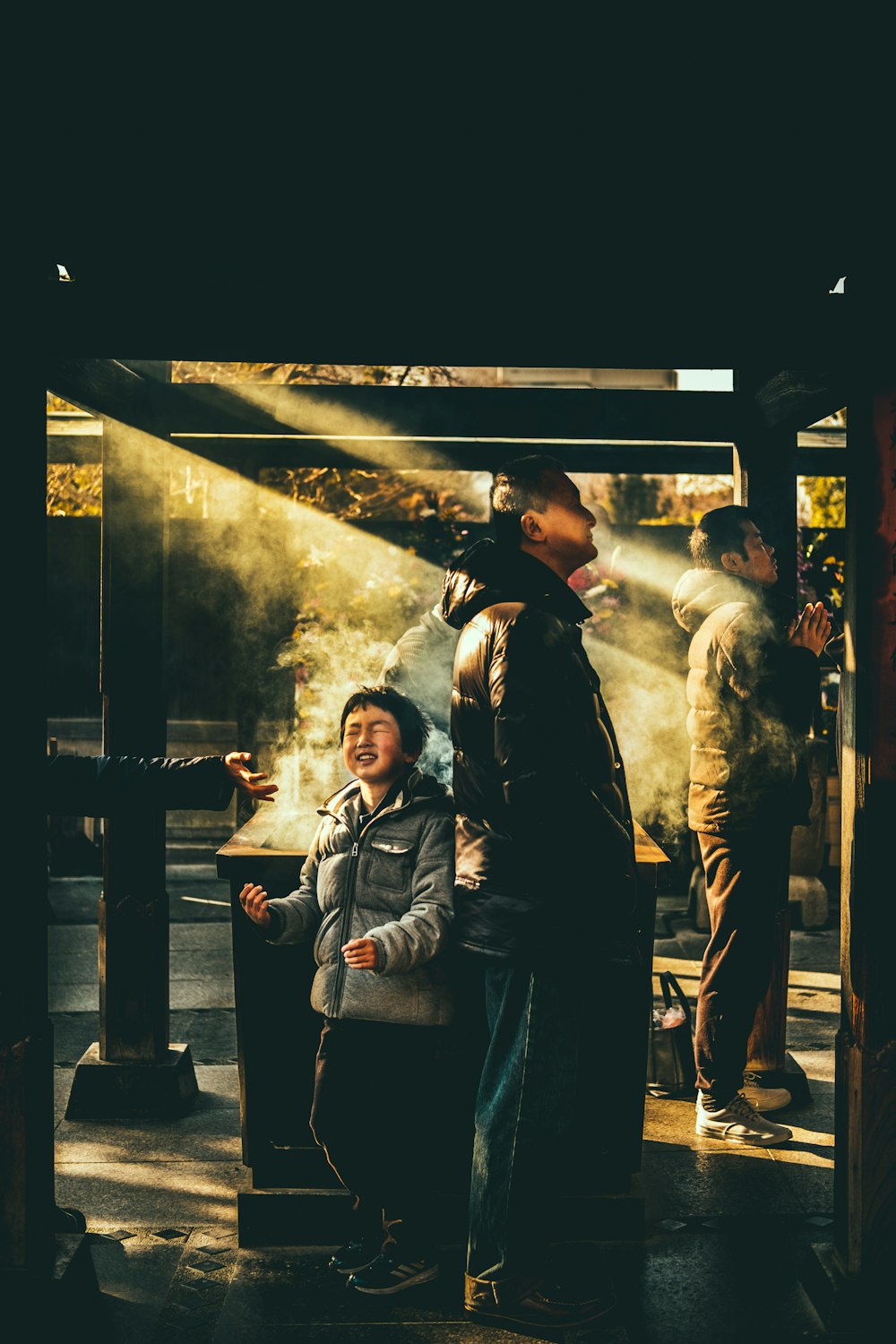 boy standing near smoke