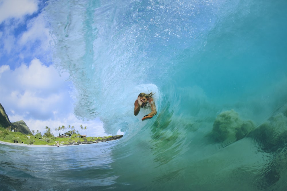 person surfing inside wave