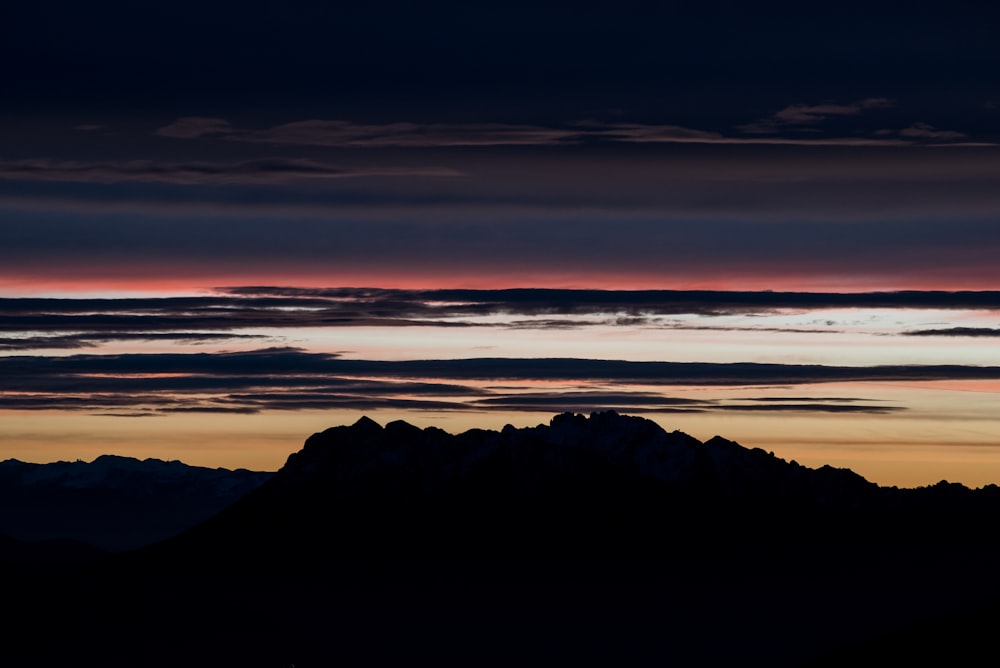 silhouette of mountains during golden hour