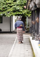 woman walking on side walk